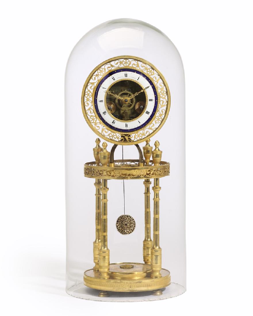 A skeletonized gilt-bronze portico clock with glass: First quarter 19th century Face signed: Chopin a Paris The circular pierced scrolling bezel centering a white and navy blue enameled face with black Roman numeral hour markers and an open center, rais
