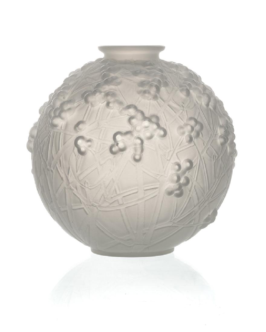 A ''Druides'' opalescent art glass vase, R. Lalique: Second quarter 20th century Etched to bottom rim: R. Lalique France No. 937 Model number 937, The moulded frosted opalescent art glass vase adorned with intersecting branches with berries 7" H x 7" Di