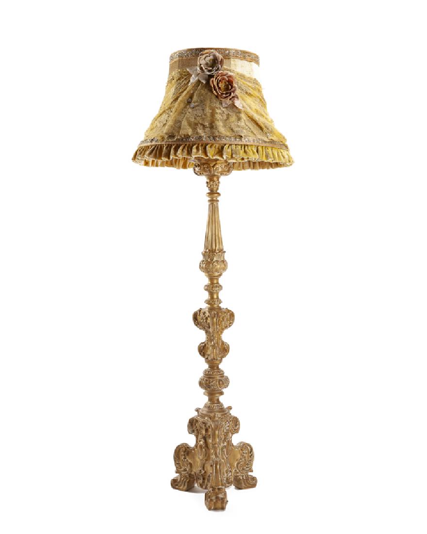 An Italian carved pricket stick-style floor lamp,: Contemporary With original Provasi paper tags to lampshade The chenille and lace lampshade over a carved gilt and gesso wood standard on tripodal base, electrified 76" H x 26" Dia. overall