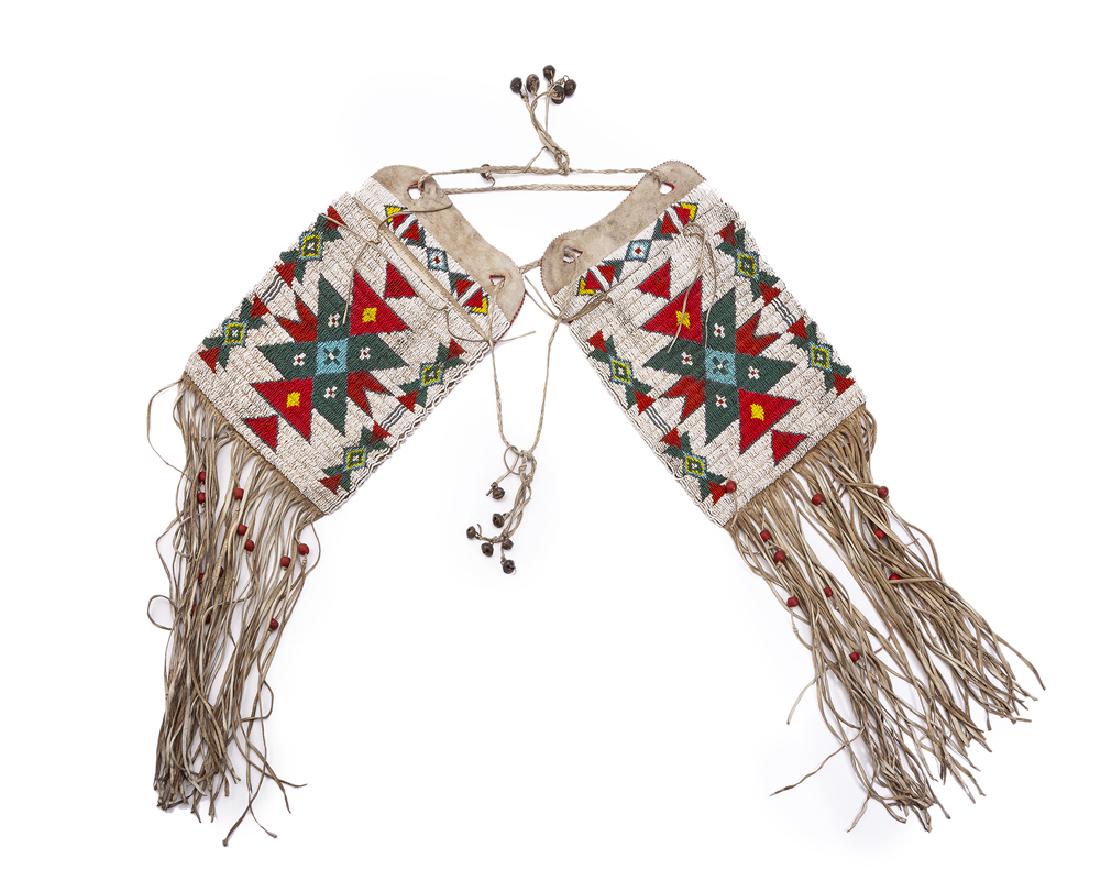 A pair of beaded Plains saddle bags with fringe (1 of 2)