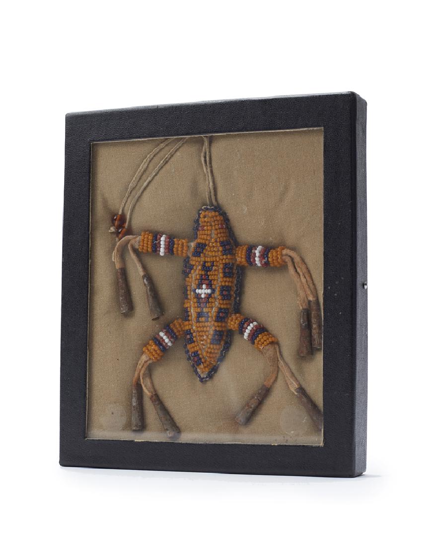 A Plains beaded umbilical fetish (1 of 2)