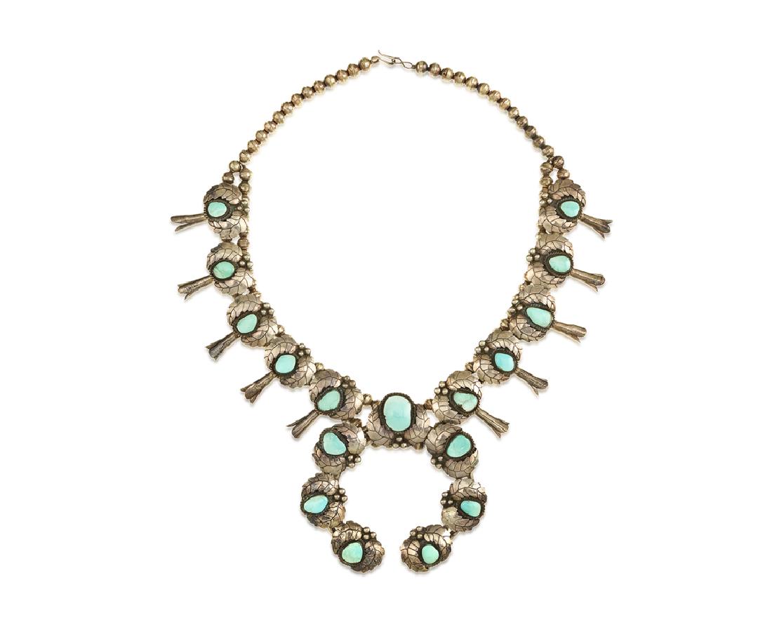 A silver and turquoise squash blossom necklace (1 of 1)
