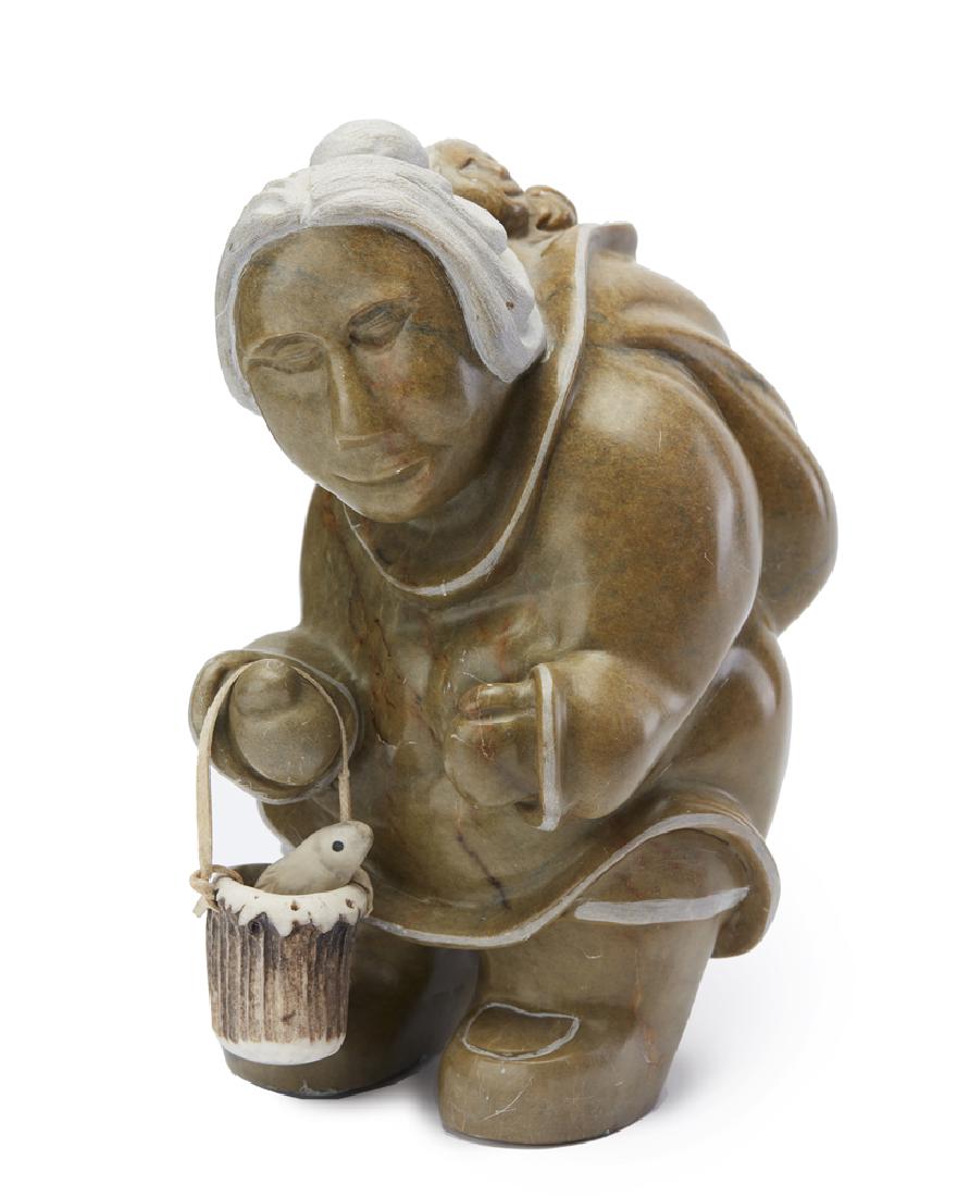 Eunicey Shytoo Muckpah (1956-* Canadian): Inuit woman and child with bucket and fish Carved soapstone, hide and bone Signed and dated to underside: *** Shytoo Muckpah / 2 14 / 1996