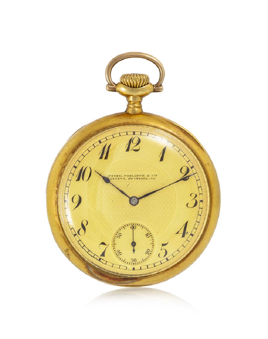 A Patek Philippe 18k yellow gold pocket watch: 1900-1910 Dial: champagne guilloché dial, black Arabic numeral hour markers, outer minute track, sunken sub-seconds, spade hands, signed: Patek / Philippe & Cie / Geneva / Switzerland Movement: 1