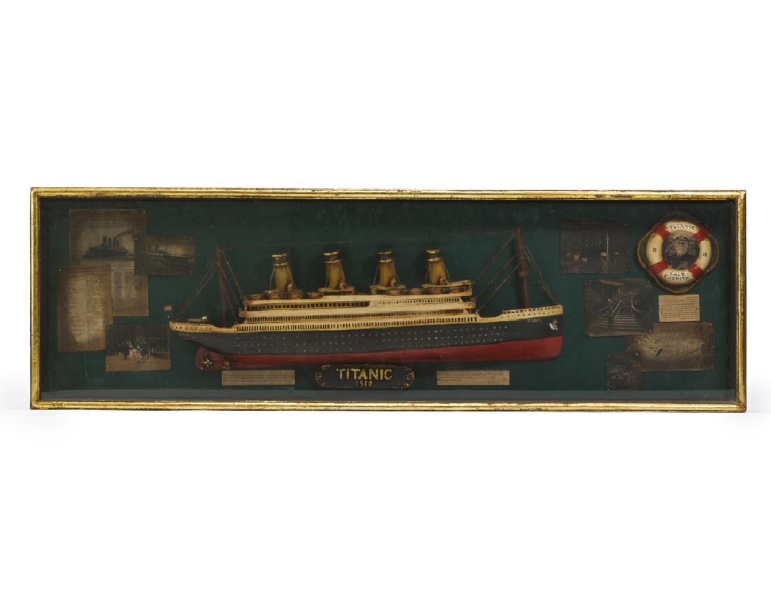 A diorama of the Titanic: 20th century A half model of the Titanic enclosed in a decorated shadowbox frame Frame: 13.125" H x 42" W x 3.25" D