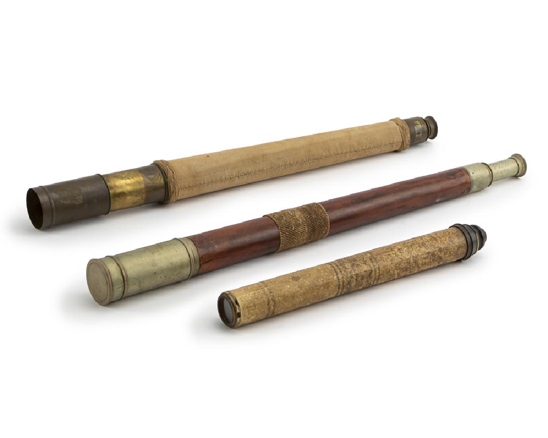 Three spyglasses/telescopes: 19th century Two marked for makers Comprising one with skin exterior, one John Browning telescope with canvas, and one Troughton & Simms brass-mounted wood telescope with inscription, 3 pieces Largest