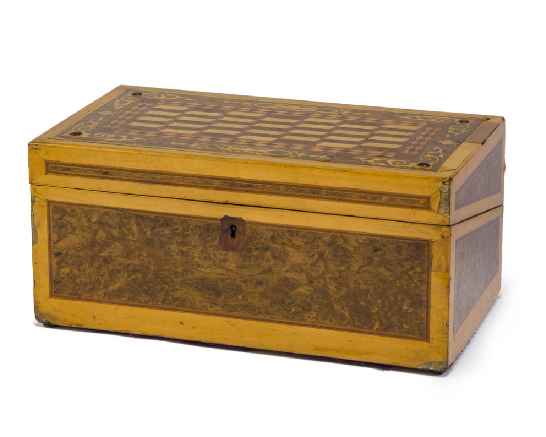 A portable writing desk: Circa 1880 Signed: Davis, Cheltenham The marquetry case enclosing a velvet-lined writing desk with writing accouterments and compartments, inscribed: Presented to my darling, Xmas 1880 6.5" H x 14" W 