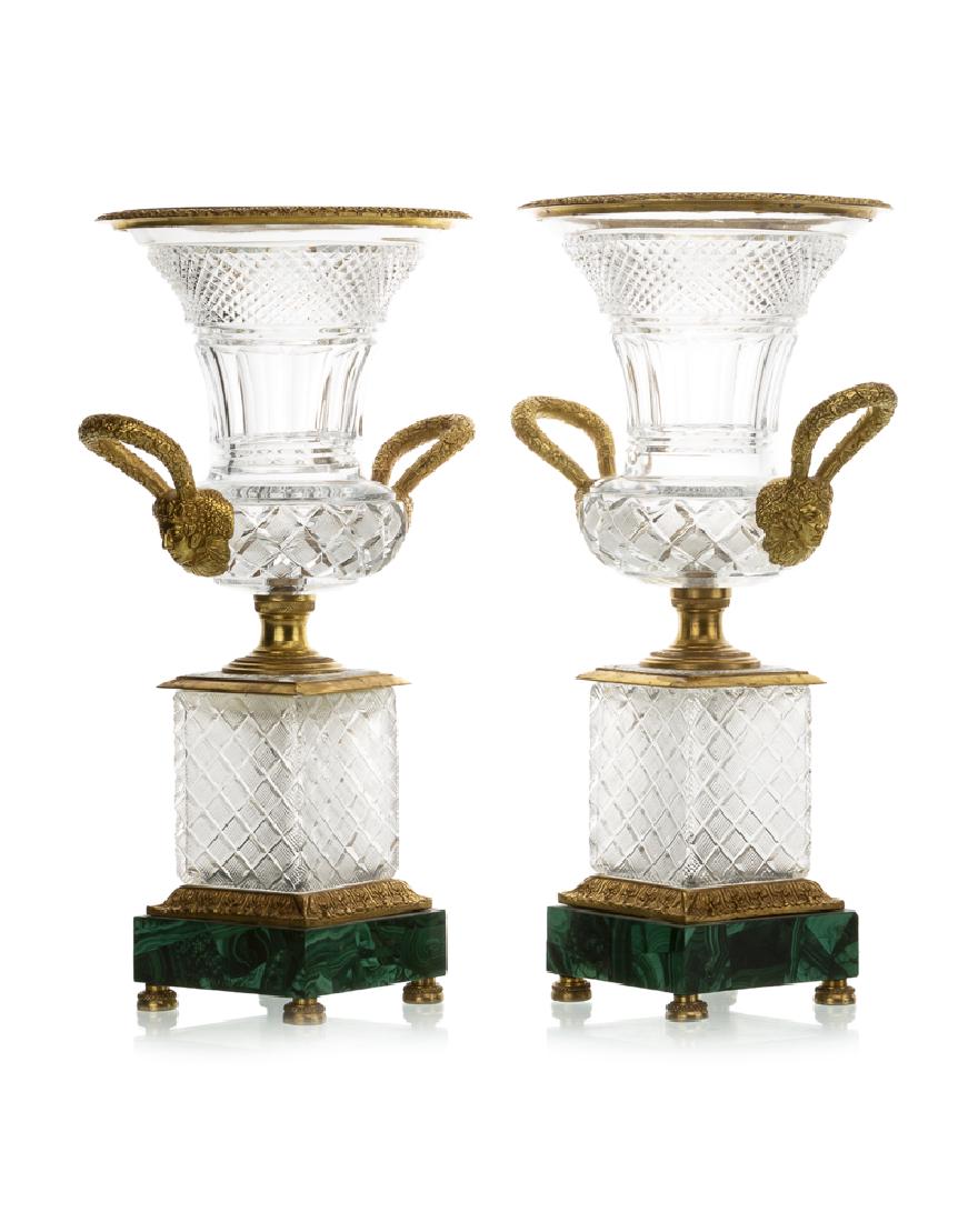 A pair of doré-mounted vases: Each cut crystal body set with bronze mounted raised on a malachite-veneered base, 2 pieces Each: 17.75" H x 11.25" W x 8.5" D