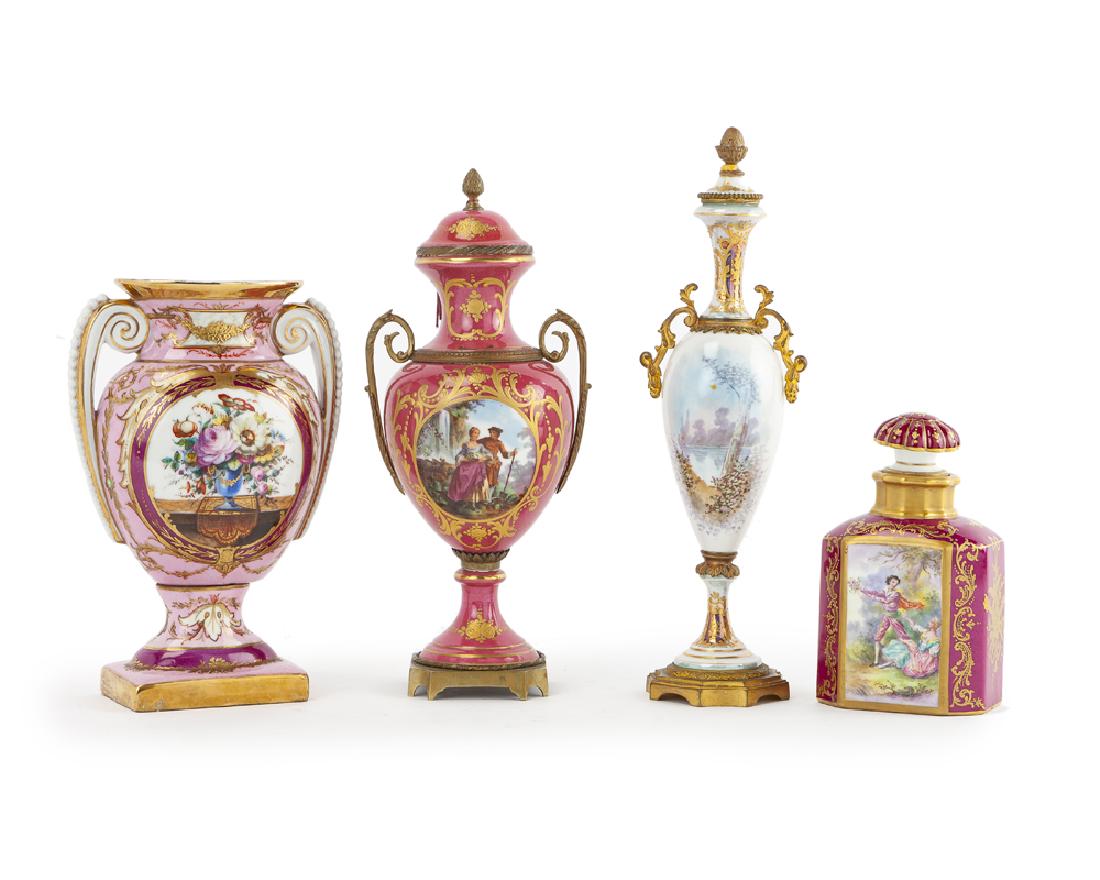 Four painted porcelain objects: 20th century Each with maker's mark to bottom Comprising a gilt-mounted lidded vase with a courting couple on white ground, a gilt bronze-mounted lidded vase with a courting couple near a waterfall on