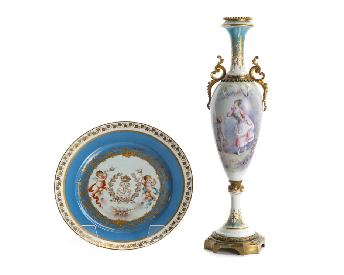 Two Sèvres porcelain items: 19th century The first signed to illustration: Daly; the second stamped: Sèvres 1846 / Château de Tuileries / SV 46. LP Comprising a Sèvres porcelain figural vase with gilt-bronze mount