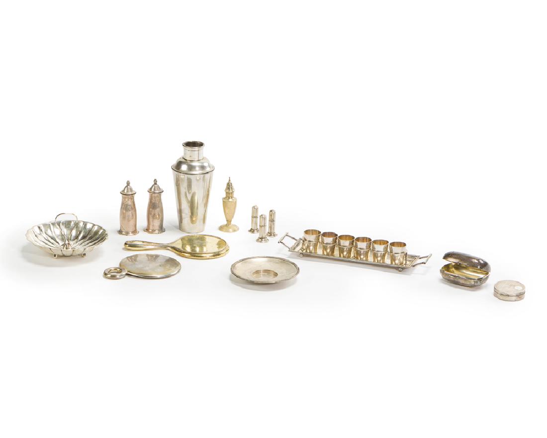 A group of sterling and 800 silver decorative objects: Soapbox stamped: Tiffany & Co. 10023 Makers 4785 Comprising a Tiffany & Co. sterling silver soap box, two hand mirrors, a German 800 silver cocktail shaker, three salt shakers, three lighters, one com