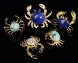 1167: A group of five gold and gemset crab brooches