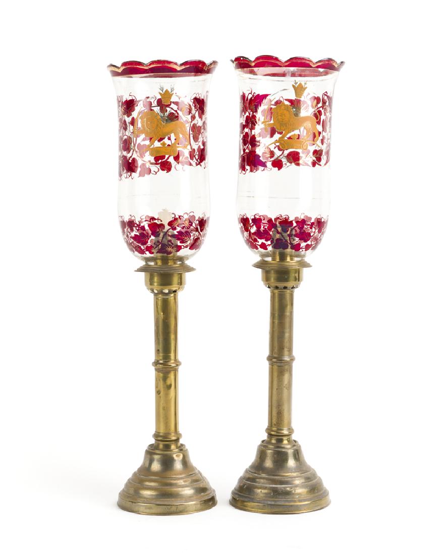 A pair of Russian brass candlesticks