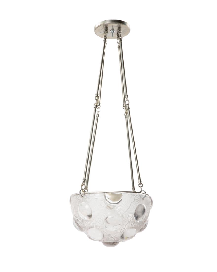 A Lalique ''Soleil'' art glass hanging light fixture: 20th century Apparently unsigned The clear and frosted glass pendant with sunflower motif hanging from a later-added fitting Overall: 33.5" H x 12.5" Dia.