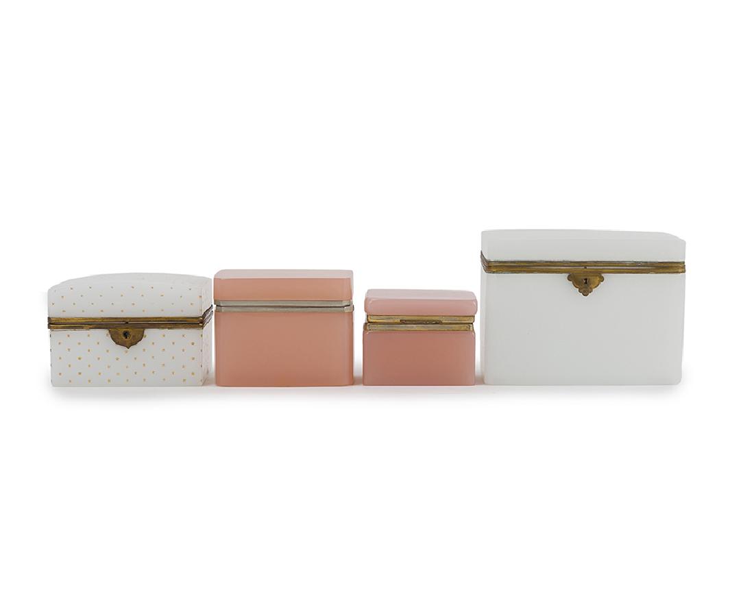 Four opaline glass vanity boxes: 20th century Comprising two rose-colored and two white rectangular lidded boxes with gilt metal mounts, 4 pieces Largest: 5.75" H x 7.625" W x 4.875" D