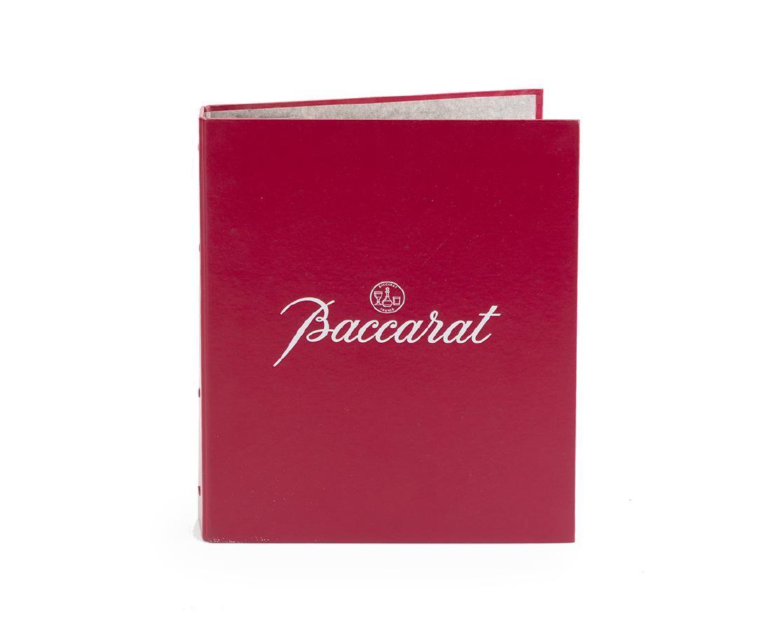 A Baccarat dealer's catalogue: 1987 In four languages: English, France, German and Italian The red leather three-ring branded binding enclosing a book of Baccarat patterns for a variety of tableware, lighting, and decorative items 