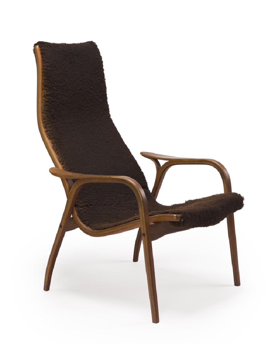 An Yngve Ekström for Swedese ''Lamino'' armchair: 1950s Stamped: Swedese Designed by Yngve Ekström Made in Sweden Designed 1953 by Yngve Ekström (1913-1988 Swedish) for Swedese, the curved back over arched arm/legs upholstered with brown shearling 