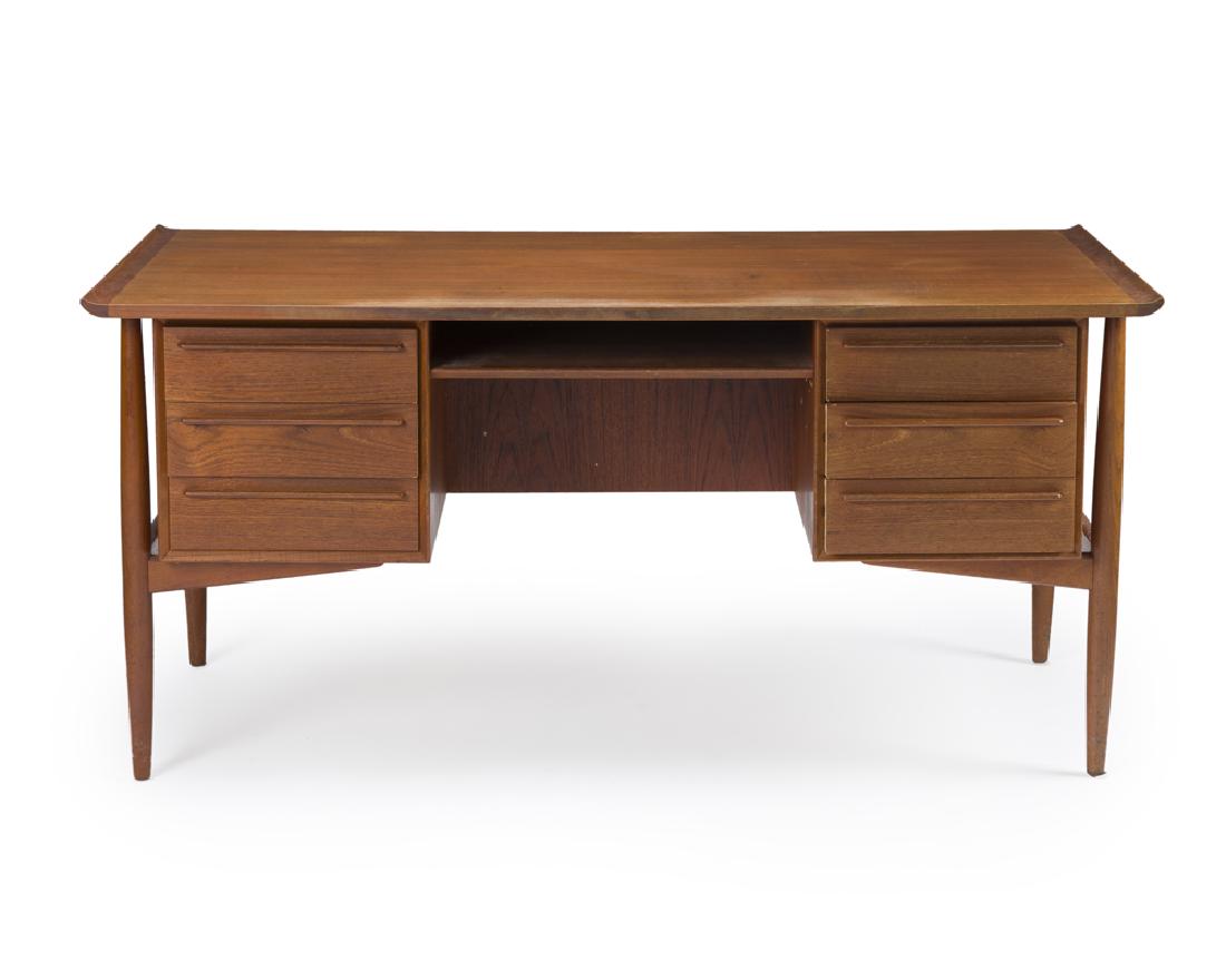 An H.P. Hansen Danish Modern teakwood desk: 1960s Stamped: Made in Denmark; Further stamped: H.P. Hansen's Mobelindustri Designed circa 1960 possibly by Arne Vodder (1926-2009 Danish) for H.P. Hansen's Mobelindustri, the rectangular wooden top