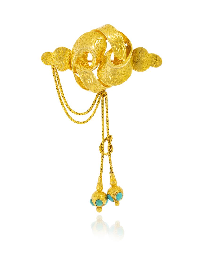 An early Victorian gold and turquoise brooch: Circa 1850, 18k yellow gold The chased knot suspending a chain terminating in turquoise inlaid drops, the reverse bearing a locket compartment with hair 3 3/4" H x 2 3/4" W 16.0 grams