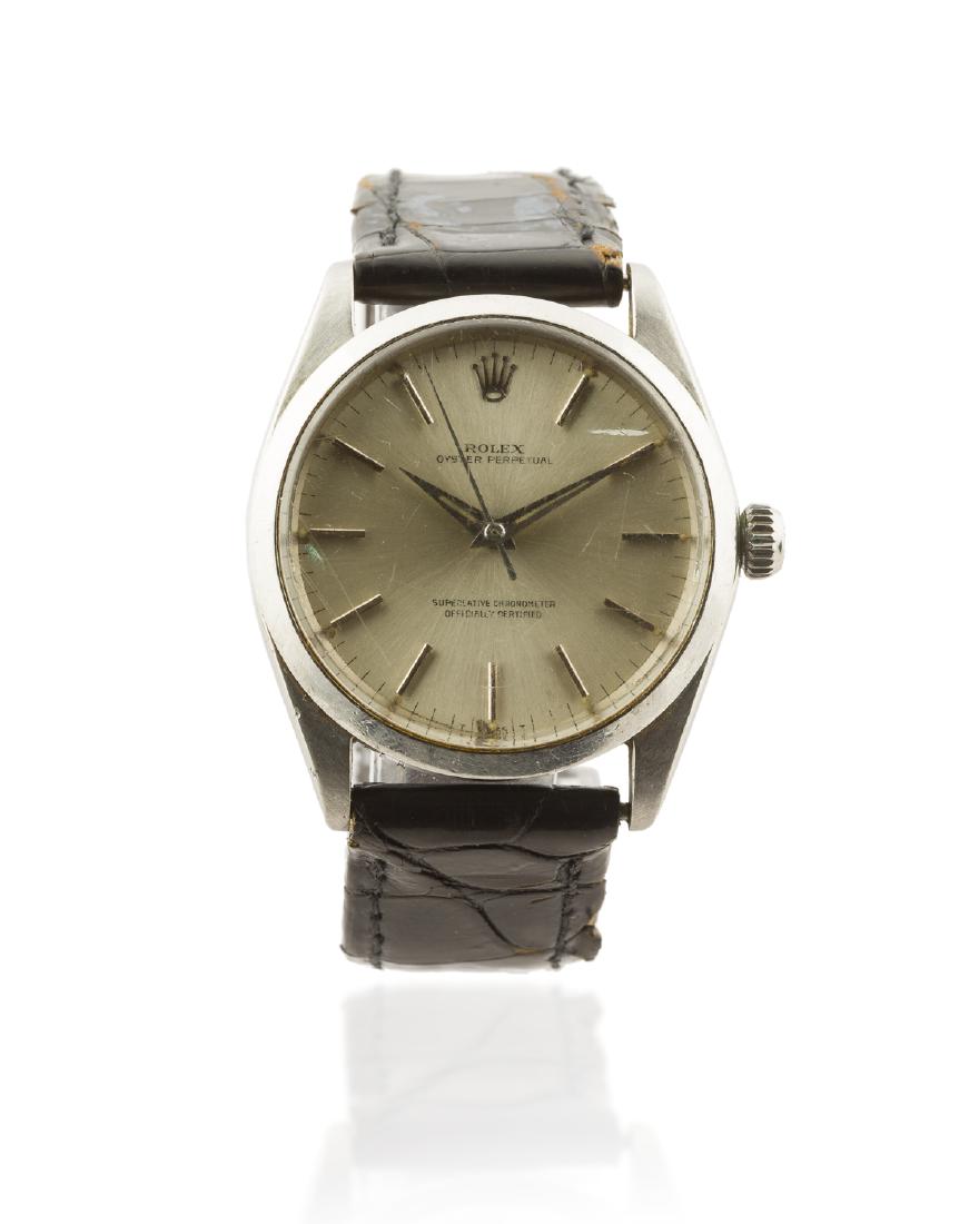 A Rolex "Oyster Perpetual" stainless steel wristwatch: 1966 Ref: 1002 Dial: Silvered sunburst dial, applied baton hour markers, outer minute indexes, Rolex crown at 12 o'clock, dauphine luminous hands, sweep center seconds, signed: Rolex / Oyster / Perp