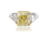 A fancy intense yellow and near colorless diamond ring