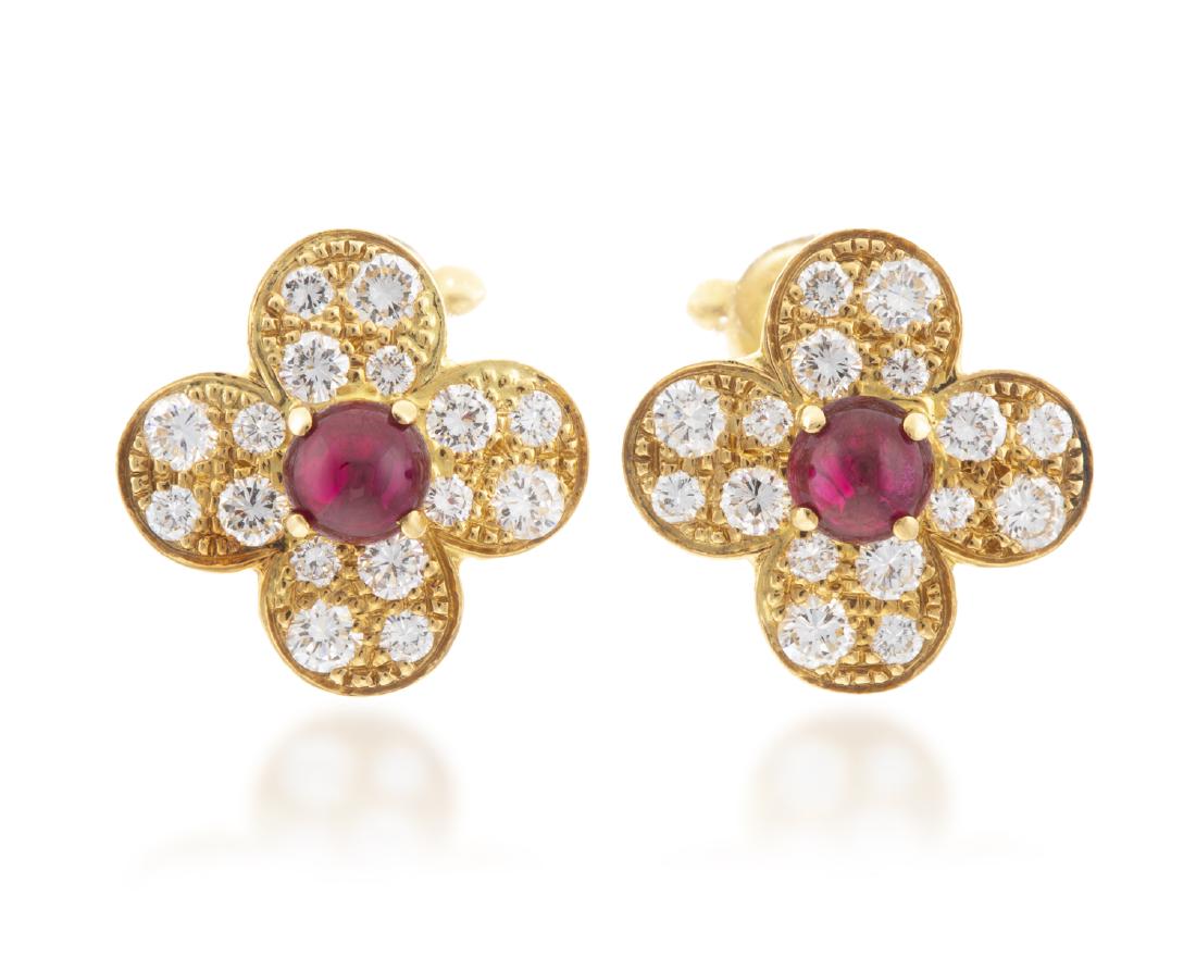 A pair of Van Cleef & Arpels ruby and diamond flower: 18k yellow gold; Each stamped VCA / 750 / (c) Each centering a cabochon ruby surrounded by pave-set diamonds 1/2 " 7.4 grams 2 pieces
