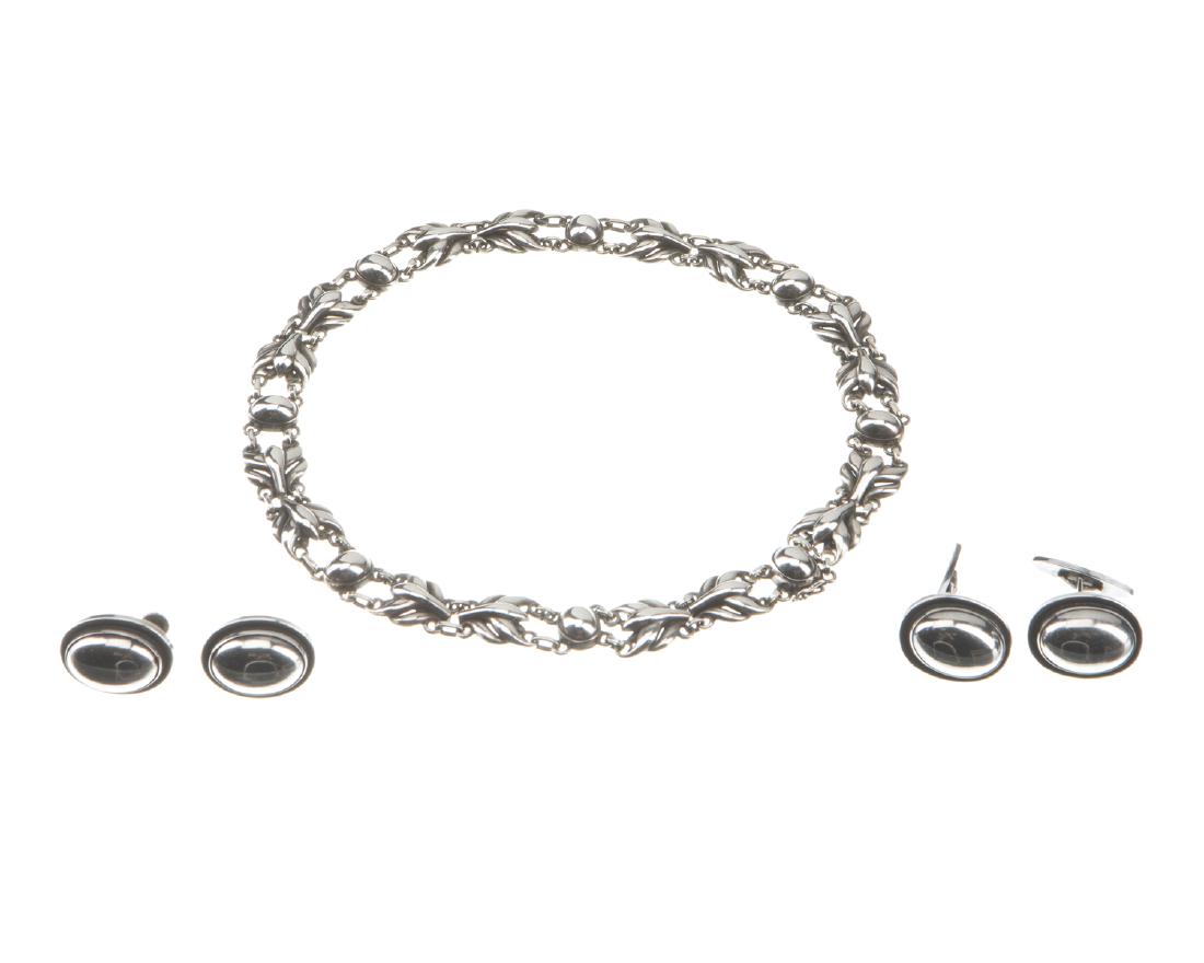 A set of Georg Jensen his-and-hers jewelry: Circa 1956, each stamped for Georg Jensen and for sterling silver Comprising a necklace No. 59, screw-back earrings No. 86, and swivel bar cufflinks No. 44, in original fitted box; All but the earrin