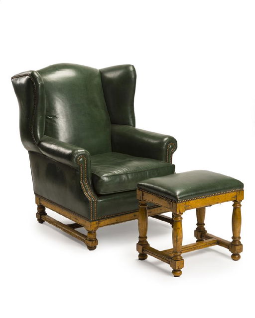A Green Leather Wing Back Chair And Ottoman