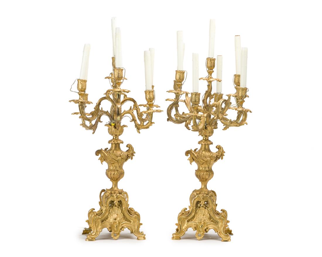 A pair of gilt-bronze seven-light candelabra: 19th century, France Each seven-light gilt-bronze candelabrum with scrolled arms set into a gadrooned urn-form base, electrified, 2 pieces Each: 34.25" H x 14.5" W x 13.5" D