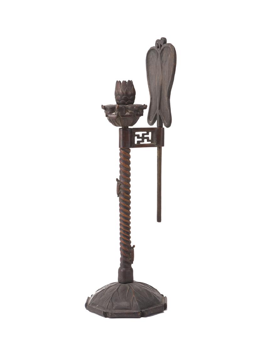 A carved wood table candle stand: 20th century With butterfly-form shield 24.75" H x 7.24" Dia.