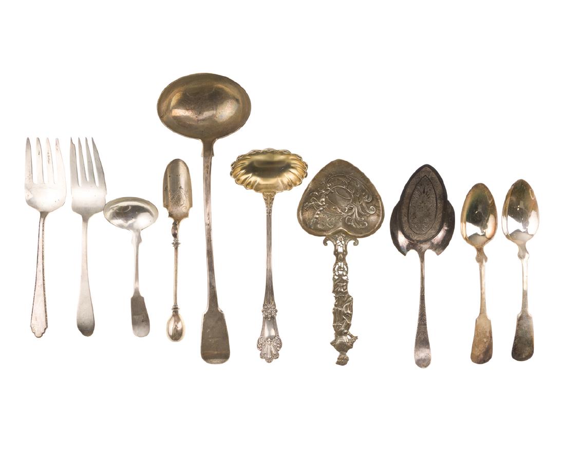 A group of flatware items: 19th-20th century Comprising six various sterling silver serving pieces, two nickel silver spoons, and two metal serving pieces, 10 pieces Largest: 13" H x 4.125" W Sterling silver items only: 21.605 