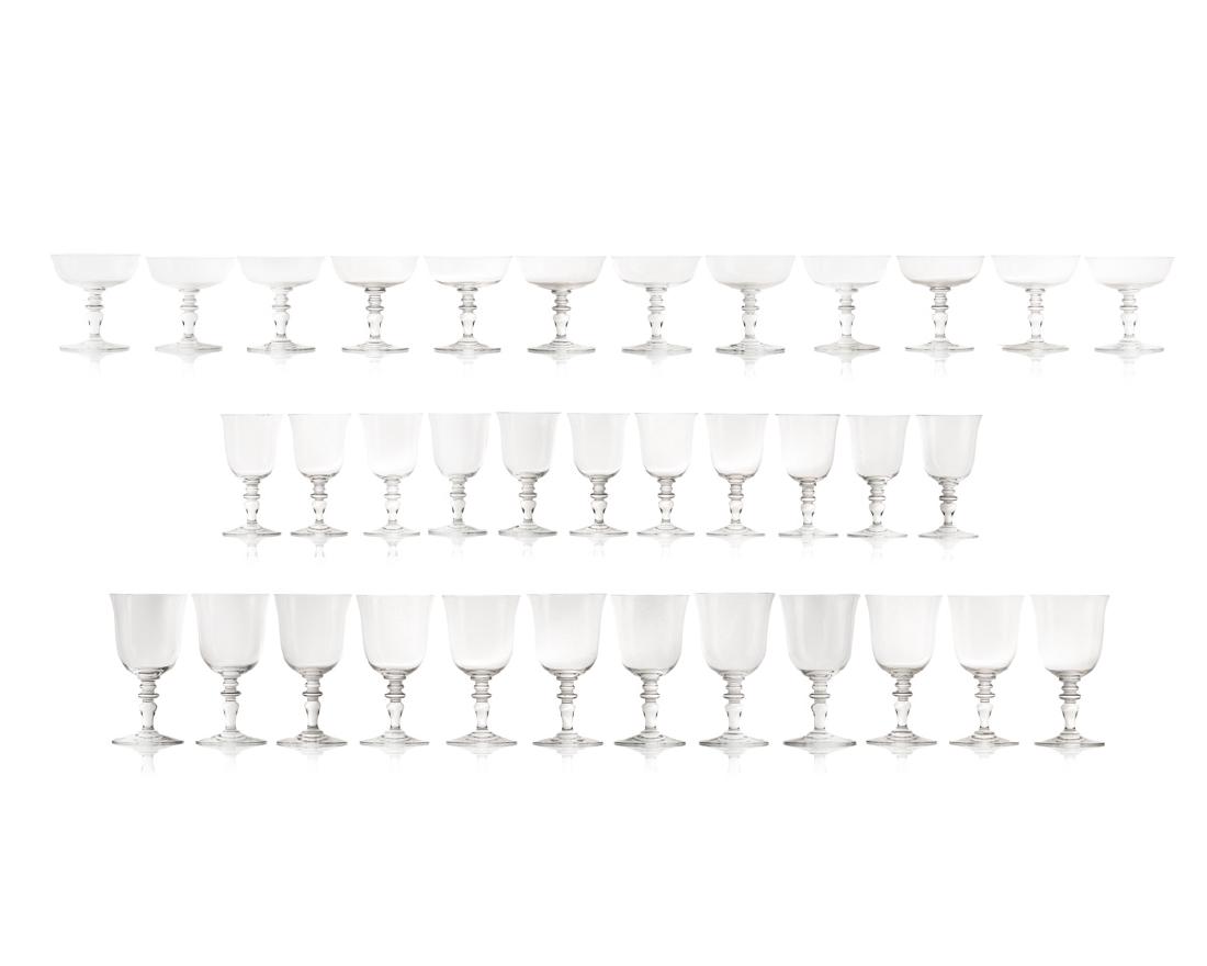 A set of Baccarat "Provence" stemware: Second half 20th century Each signed for Baccarat Comprising 12 tall water goblets, 11 claret wine glasses, 12 champagne/tall sherbet glasses, 35 pieces Largest: 6.875" H x 3.625" Dia.