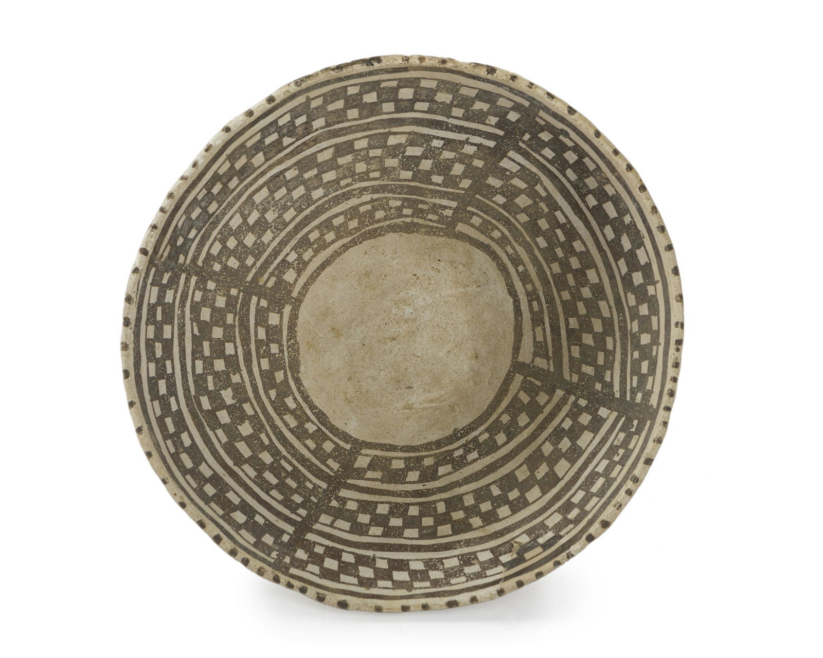 An Anasazi pottery bowl: Pre-historic Hand coiled and pit fired with black on white classic Chaco checkerboard interior 4.25" H x 9" Dia. Provenance: C.J. Collection, Apache Junction, AZ; Acquired by Old Adobe Traders, S