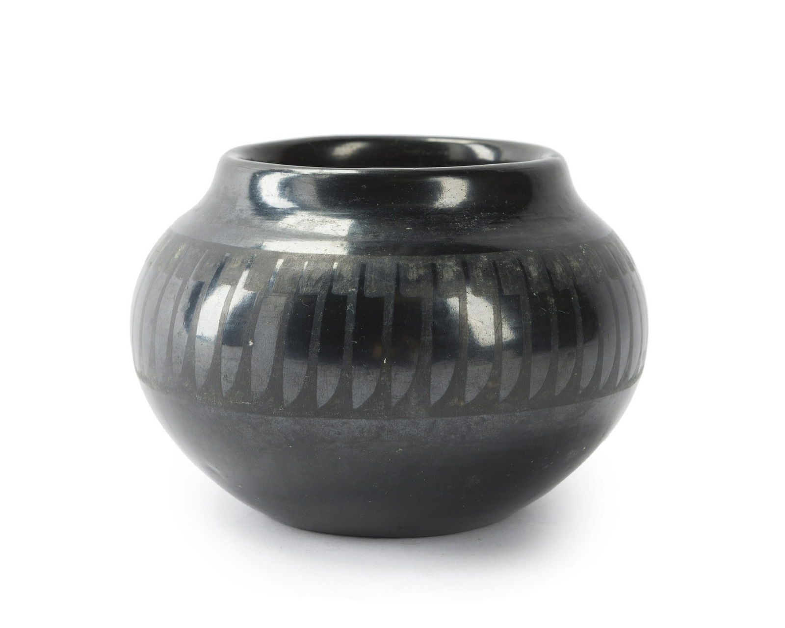 A San Ildefonso blackware pottery jar, Maria and: Mid-20th century Base marked: Marie + Santana "Feather Bowl" 3.75" H x 5.5"Dia.