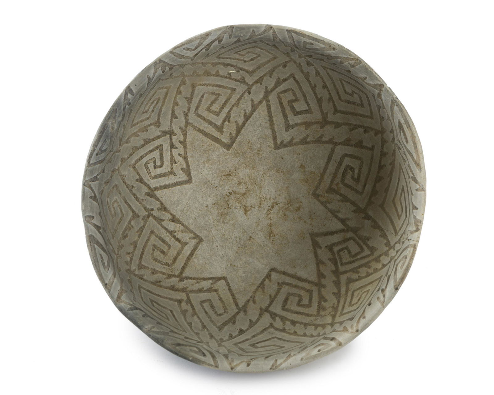 A Mimbres Mogollon pottery bowl: Pre-historic Hand coiled and pit fired with black on white geometric interior geometric interior motif 6.26" H x 10.75" Dia. Provenance: C.J. Collection, Apache Junction, AZ; Acquired by Old Adob