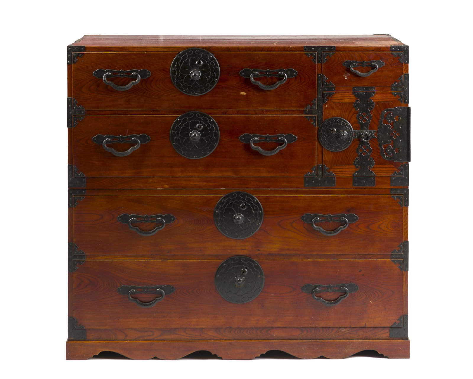 A two-piece Japanese Tansu: Late Meiji era The rectangular cases fitted with a total of five drawers and a hinged cabinet enclosing to additional drawers set with foliate-motif mounts with brass hardware, with keys 41" H x 43" W