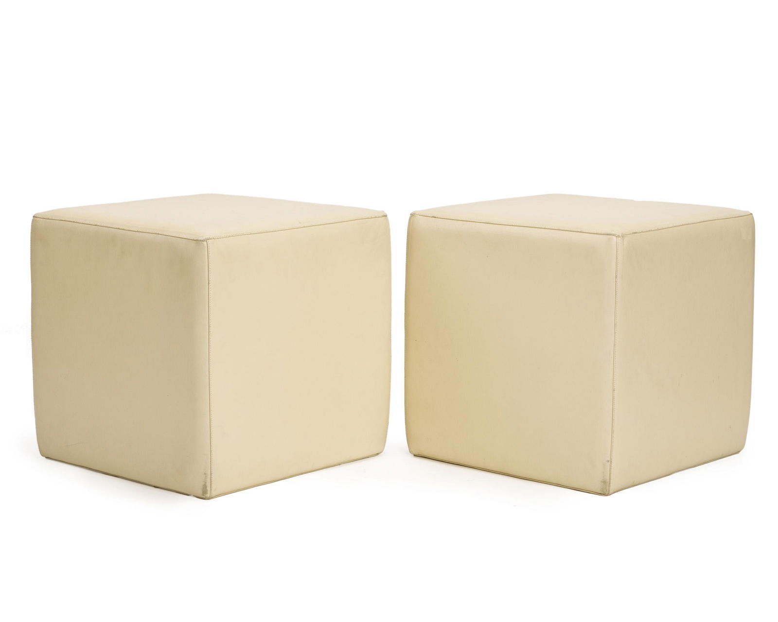 John Dickinson (1920–1982 American): Pair of custom cube ottomans, circa 1970 Leather upholstery Each: 17.25" H x 17.5" W x 17.5" D Provenance: Property from the Keoshian Collection