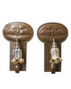 A pair of Glasgow School copper bat sconces