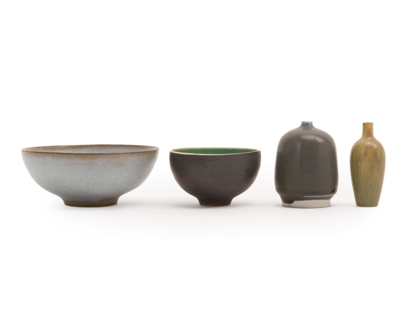 Four Scandinavian glazed pottery pieces: Circa 1970s One small miniature vase signed: C.H Stalhane Comprising two miniature vases and two miniature bowls, 4 pieces Largest: 1.75" H x 4.25" Dia.