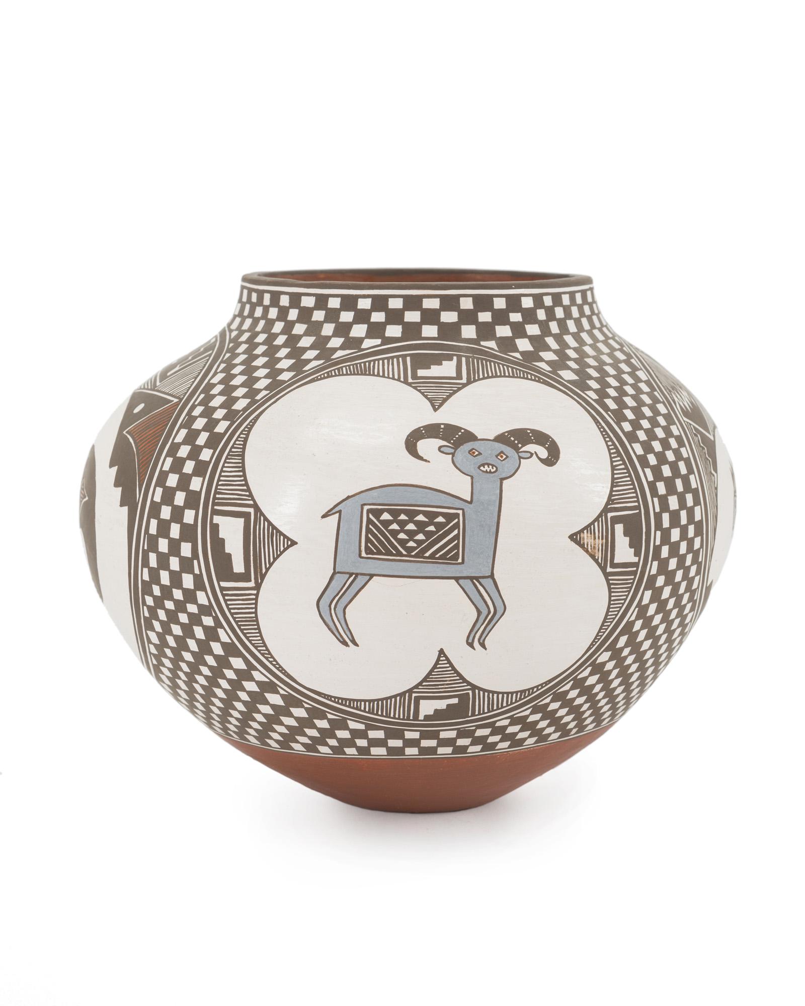 An Acoma Pueblo polychrome pottery jar: Fourth quarter 20th century Marked to underside: Aaku N.M/ 9030/ Dzaisvotyeit'sa/ Lilly "Prey and Predator in Snowstorm," comprising an olla-form vessel with four medallions depicting variou