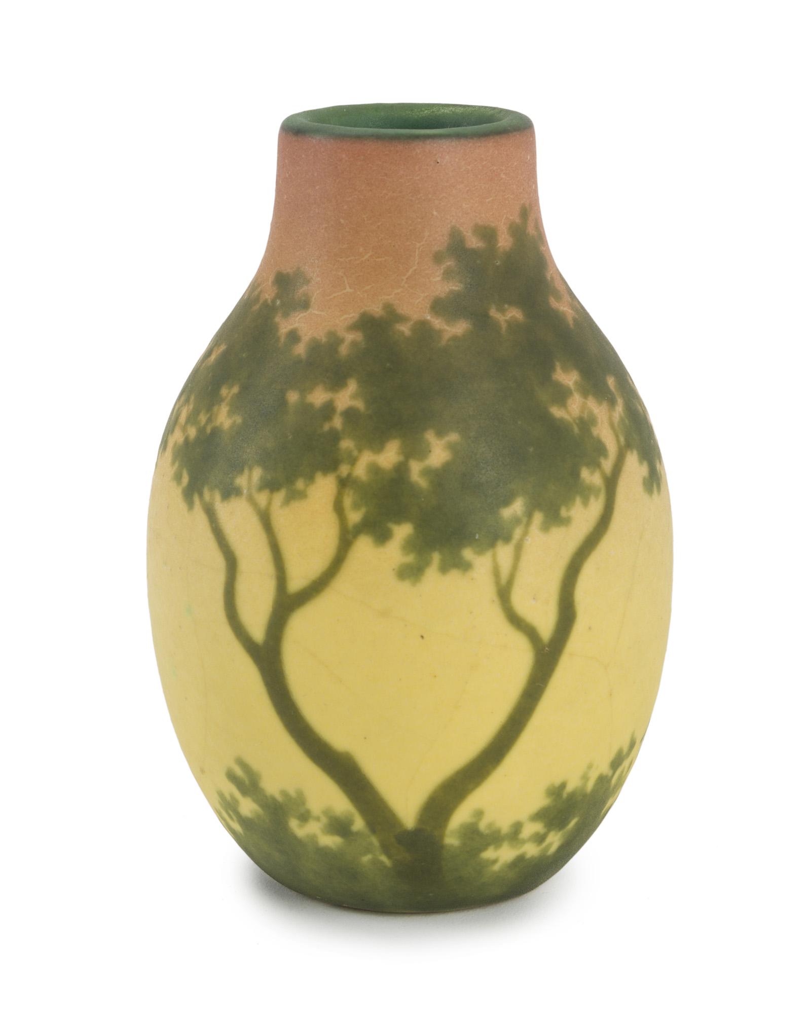An Almeric Walter landscape pottery vase: First quarter 20th century, Nancy France Artist signed: A Walter/ Nancy to side: further marked: AW France Landscape with tree on a fading rose to yellow background, with a green interior 5.5"