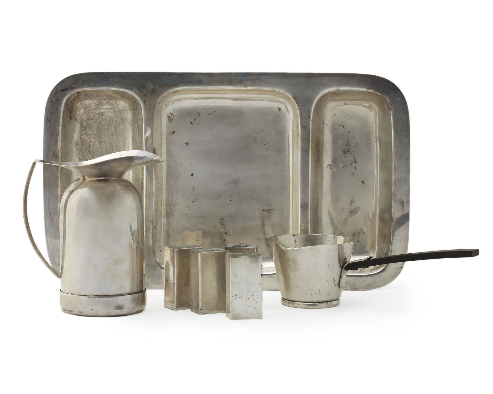 Seven Allan Adler sterling silver table items: Mid-20th century Each stamped: Allan Adler/Sterling Comprising a divided serving platter, an insulated coffee carafe (lacking stopper) a Town and Country saucier with ebony handle, and four salt and