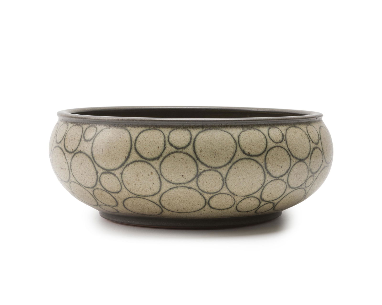 Harrison McIntosh (1914-2016 Claremont, CA): Low bowl Ceramic, green engobe with applied circles Paper label: Stamped HM 4.25" H x 11.75" D Provenance: Fireside Gallery, Carmel, CA