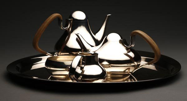 Georg Jensen sterling coffee tea service: Designed in 1952 by Henning Koppel, marked ''Dessin / HK / Georg Jensen / Denmark Sterling / 1017'', comprising a coffee pot (6.75 x 9.25"), a teapot (4.5 x 9.50"), both with teakwood handles, a cream