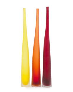 Three Laura de Santillana "Bambu" art glass vases: Fourth quarter 20th century Each signed: Laura de Santillana Comprising one orange, one yellow, and one red, 3 pieces Each approximately: 21.75" H x 2.75" Dia.