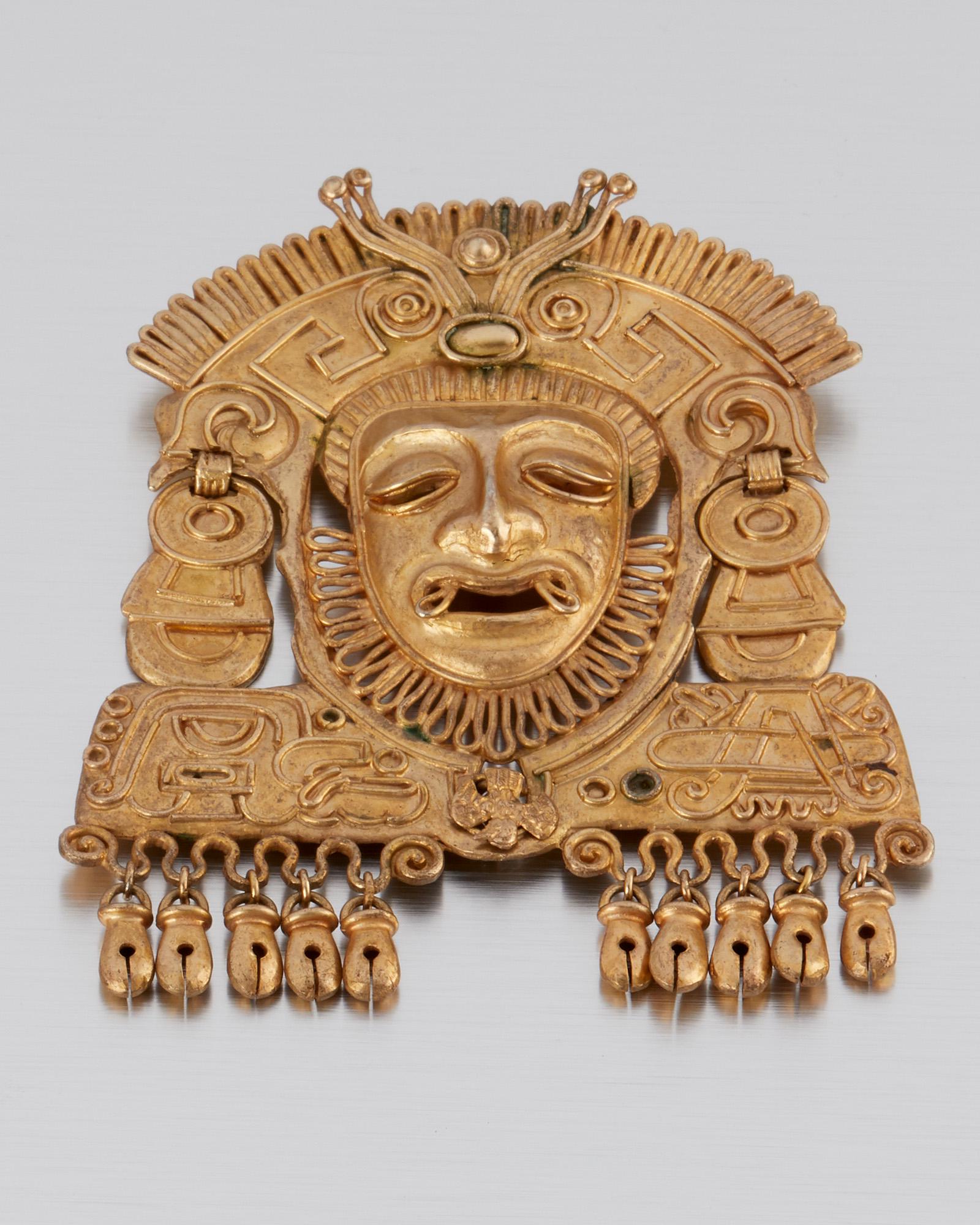 A Matl silver vermeil pendant/brooch: 1935-1948; Taxco, Mexico Stamped: Matl; Further stamped: Mexico / 925 Designed by Matilde Poulat, the large figural Mixtec-style pendant/brooch finished with decadent fringe 4.5" H x 3.875" W 88.0 gra