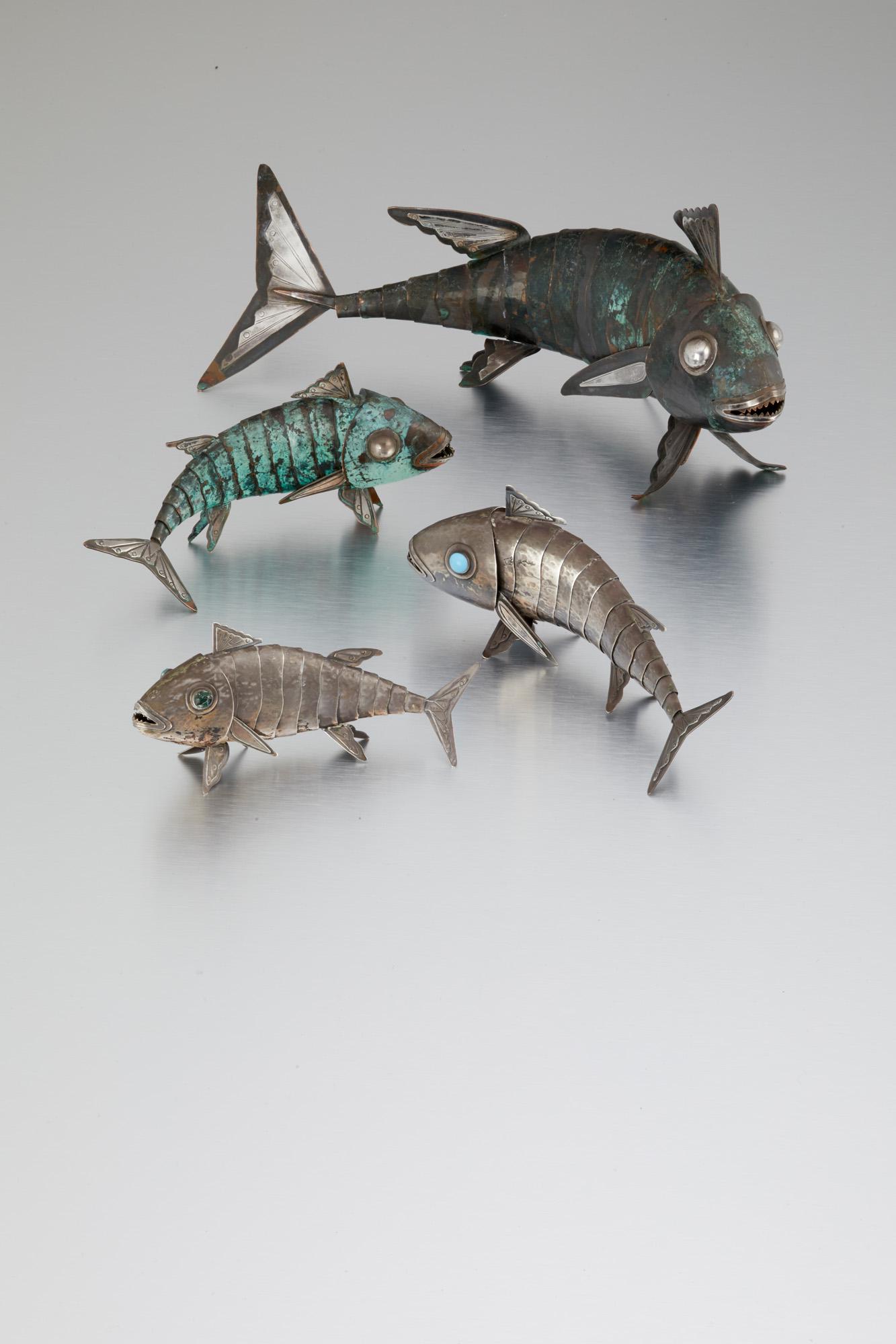 Four Graziella Laffi silver and mixed-metal articulated: Third quarter 20th century; Peru Each stamped for Graziella Laffi; Further stamped: 925 Each fish designed with articulated scales, 4 pieces Largest: 6.25" H x 13.25" W x 3.25" D 35.410 gross oz. troy