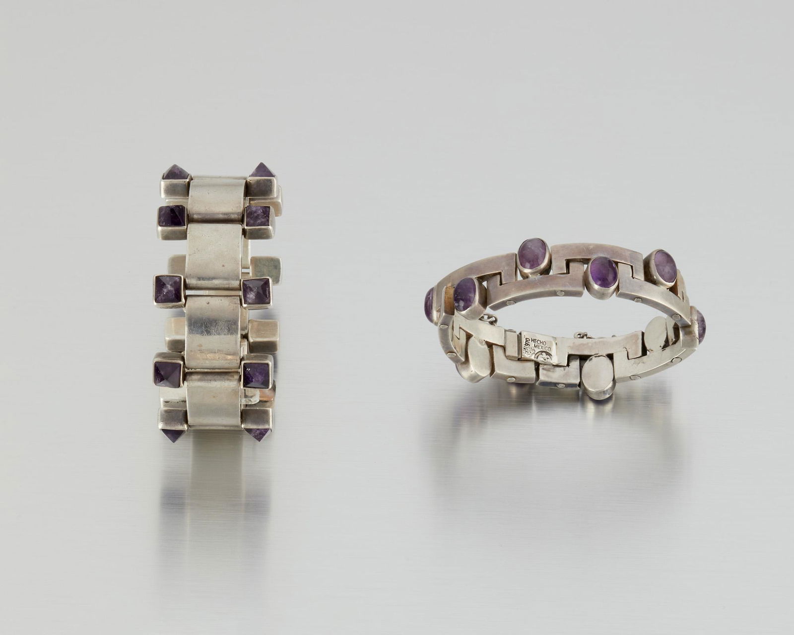 Two Antonio Pineda silver and amethyst bracelets: 1953-1979; Taxco, Mexico Crown mark for Antonio Pineda; Eagle 17; Each variously stamped: Hecho en Mexico / 970 / Silver Comprising two architectural-link bracelets, one set with pyramidal amethysts