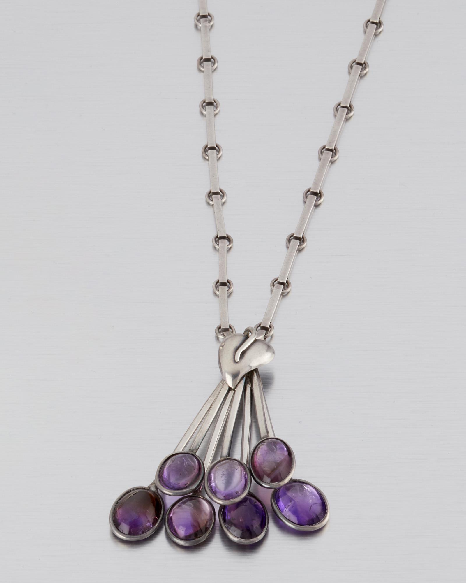 An Antonio Pineda silver and amethyst necklace: 1953-1979; Taxco, Mexico Crown mark for Antonio Pineda; Eagle 17; Each variously stamped: Hecho en Mexico / 970 The silver leaf pendant with silver wire dangles tipped with amethyst cabochons suspendi