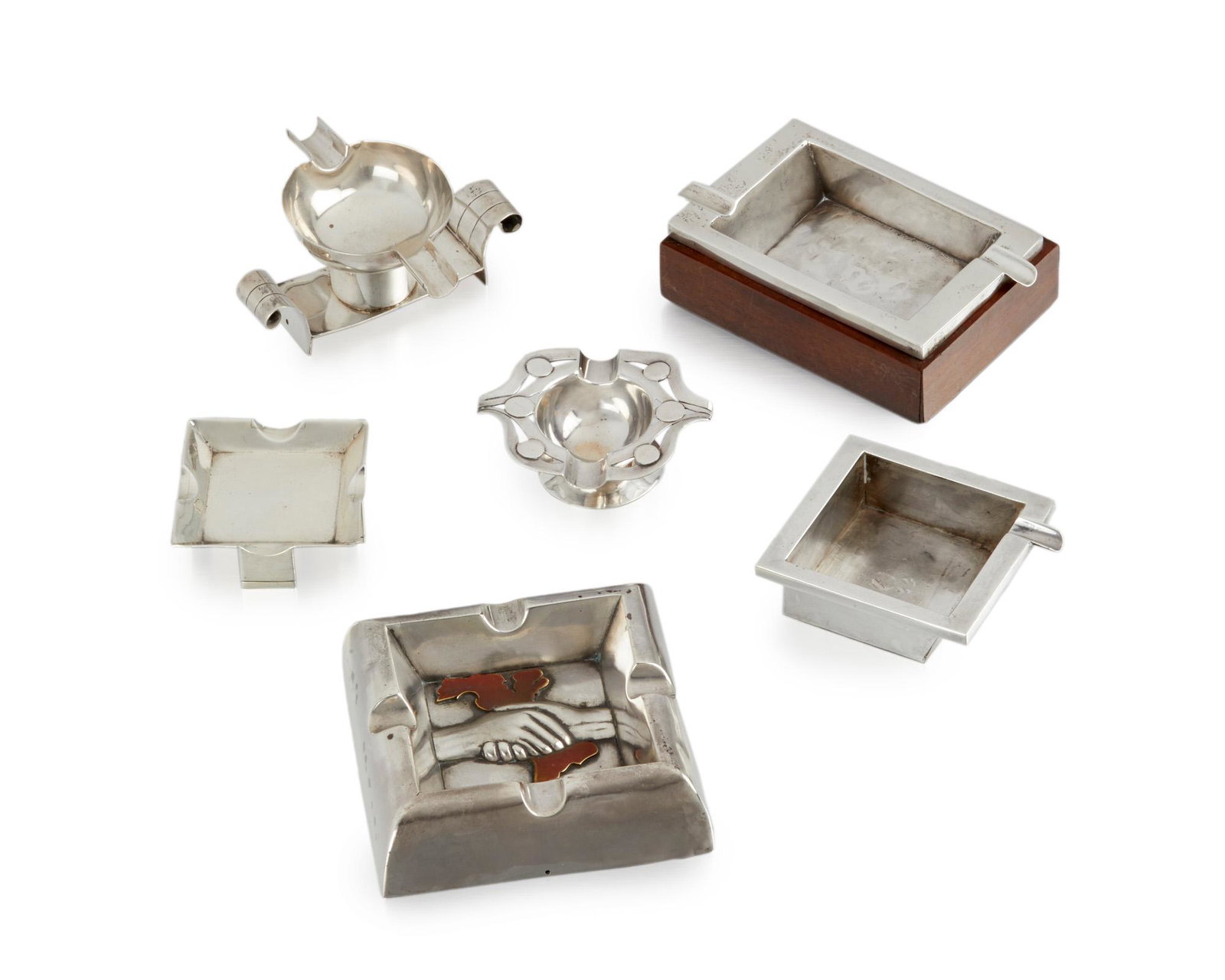 Six William Spratling silver ashtrays: 1940-1944 and 1949-1951; First and Second Design Periods; Taxco, Mexico All but one stamped for William Spratling; Three further stamped: Spratling Silver; One stamped: Eagle 30; One stamped for Conqu
